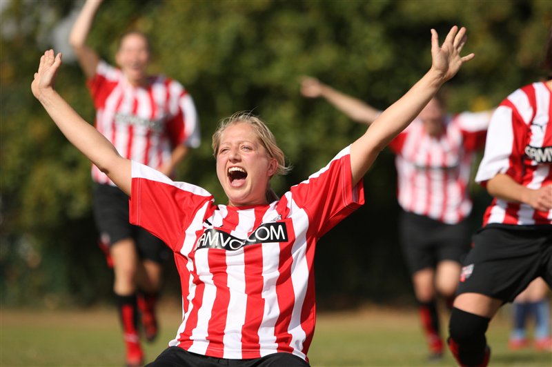 Young woman celebrates goal