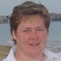 Photo of a woman stood in front of the sea