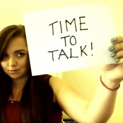 Kerry holding "time to talk" sign