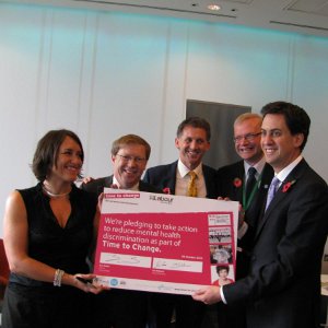 Time to Change Director Sue Baker, Mind Chief Executive Paul Farmer and Rethink Mental Illness Chief Executive Paul Jenkins attend an event with Leader of the Labour Party Ed Miliband as he signs the Time to Change pledge