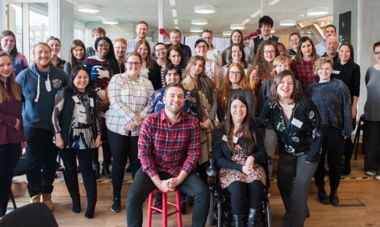 a group of young people posing for a camera