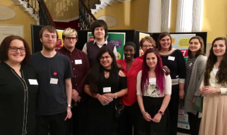 a group of young people posing for a camera