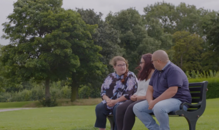 a father and daughter talking in a car