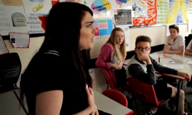 a teacher delivering a mental health session at school